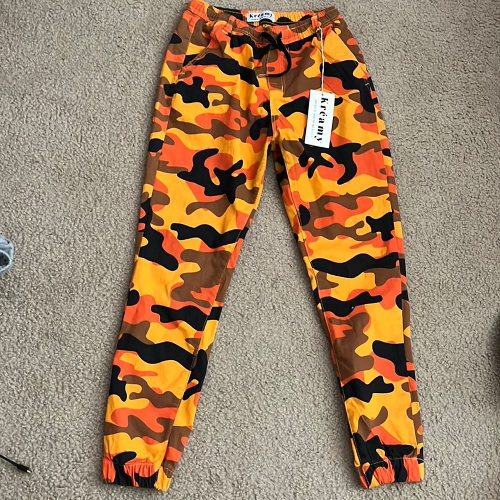 NWT Camoflauge pants with drawstring waist and stretchy bottom legs by ankle.